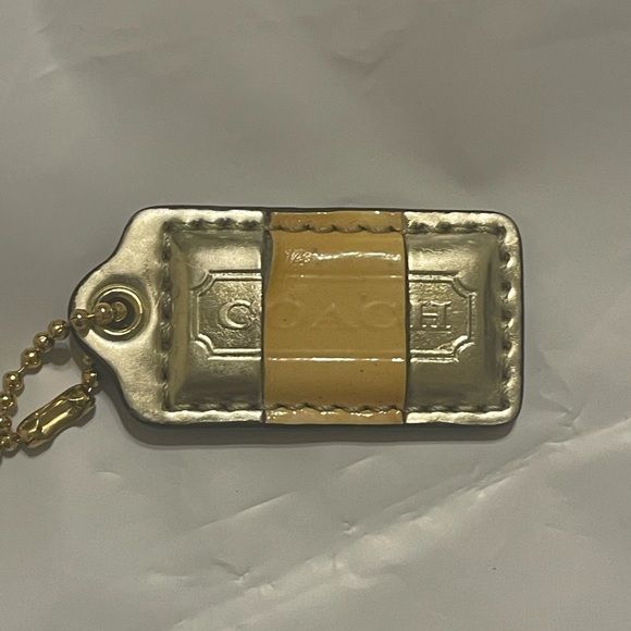 Coach Metallic gold and mustard Tag Keychain - Picture 2 of 3
